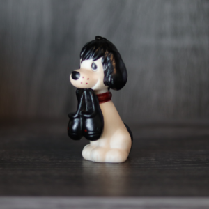 Repainted Precious Moments Doll (an Unprecious Moments Doll) of a dog holding slippers